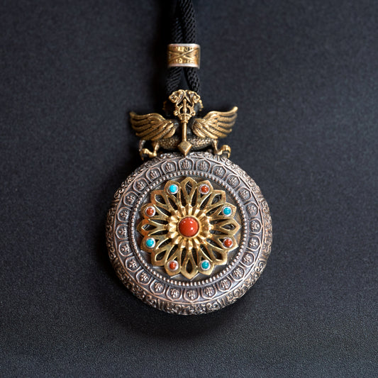 Tibetan silver carved Buddha pendant